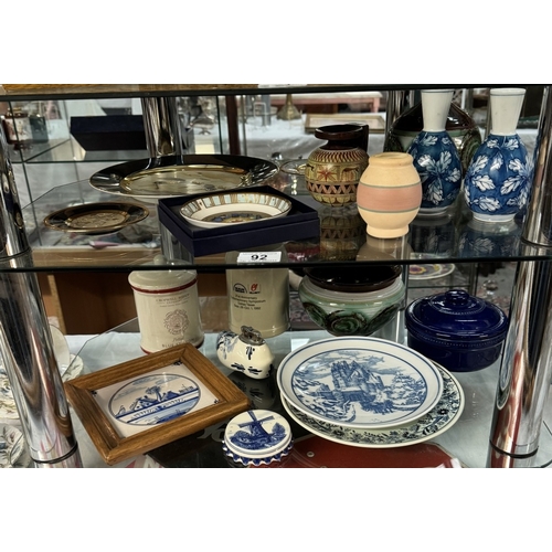 92 - A mixed lot of pottery, china etc on 2 shelves including Delft