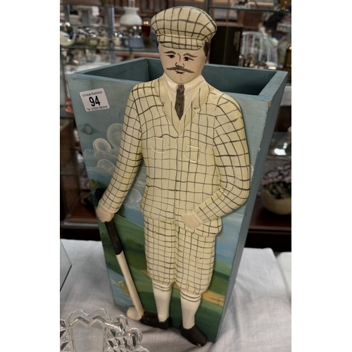 94 - A wooden stick/umbrella stand featuring a figure of a golfer