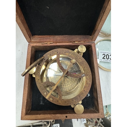 202 - A brass compass / sundial in hardwood case