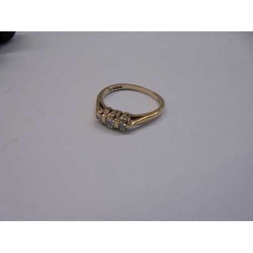 1081 - A vintage diamond three stone gold ring, size J half, 1.8 grams.