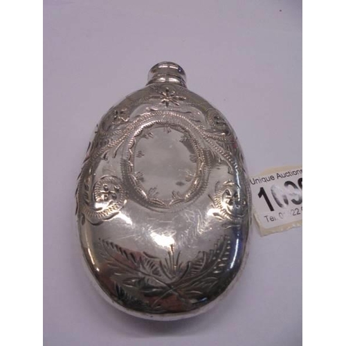 1099 - A silver plated hip flask.