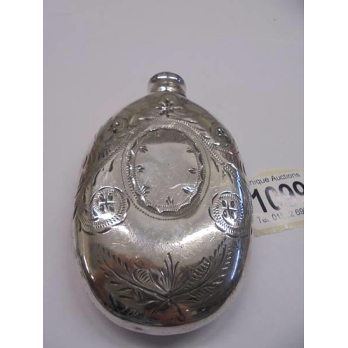 1099 - A silver plated hip flask.