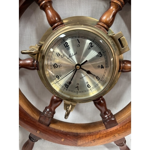 233 - A ships wheel with a centre Solent clock