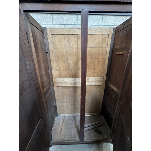 345 - A large antique oak wardrobe A/F (133 x 57 x 226cm)