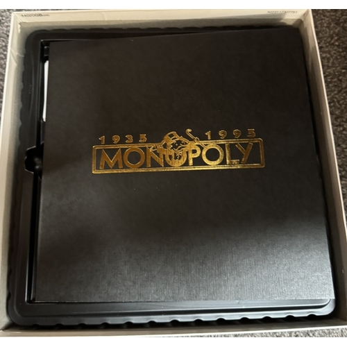 434 - A Monopoly 60th Anniversary set & Trivial Pursuit game. Both unchecked.