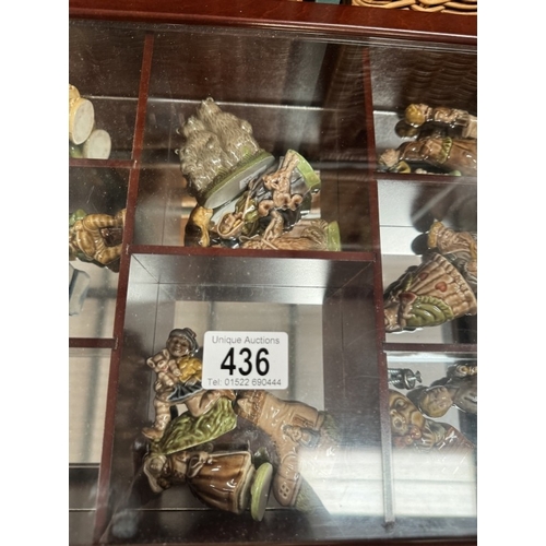 436 - 21 Wade nursery rhyme figures in display cabinet