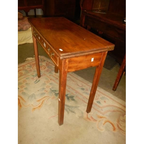 1563 - A Victorian mahogany fold over games table, COLLECT ONLY.