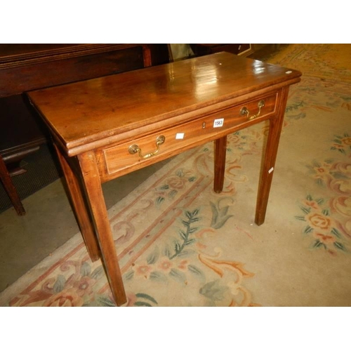 1563 - A Victorian mahogany fold over games table, COLLECT ONLY.