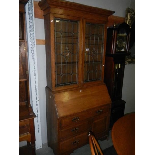 1606 - A lead glazed bureau bookcase. COLLECT ONLY.