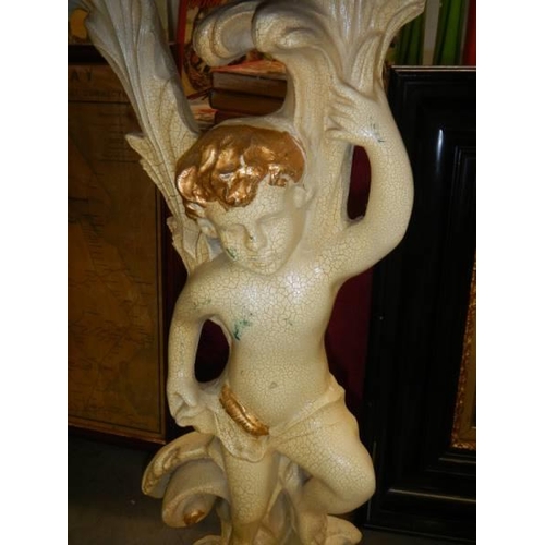 1617 - A marble topped console table supported by a cherub. COLLECT ONLY.