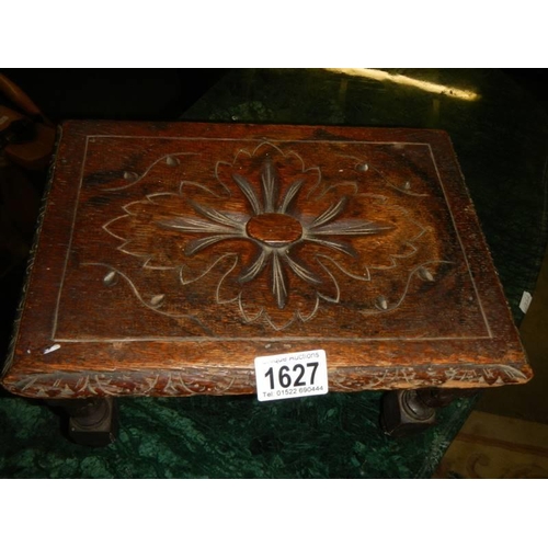 1627 - An old 20th century carved foot stool.