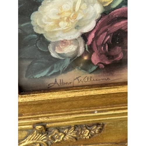 1621 - A pair of gilt framed prints still lifes of roses / flowers