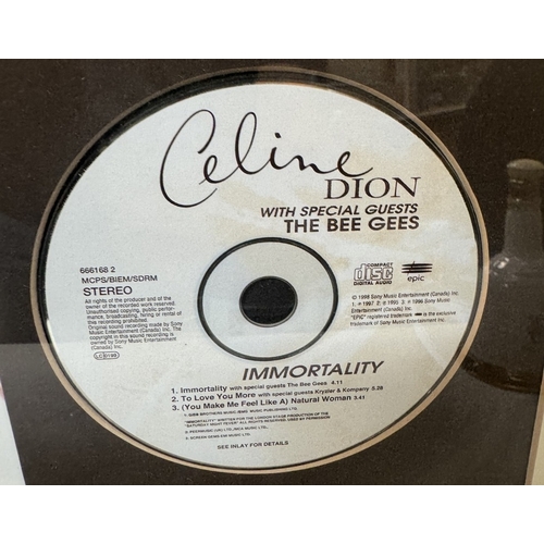 1633 - A Celine Dion with Bee Gees & Roachford framed CDs