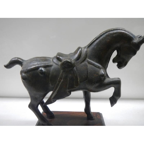 1672 - An old cast iron Tang horse.