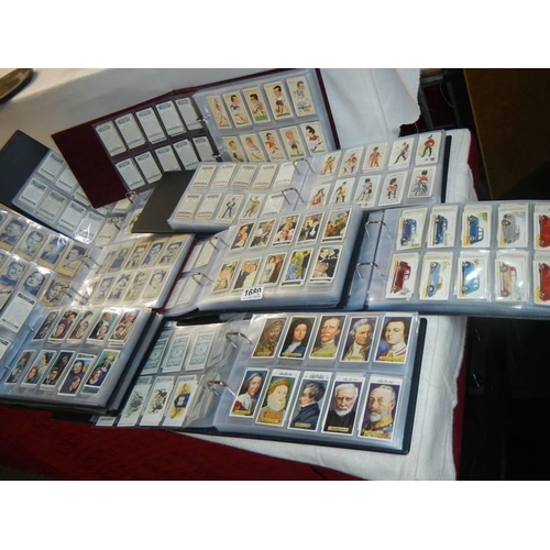 1680 - Nine albums of part sets of cigarette cards.