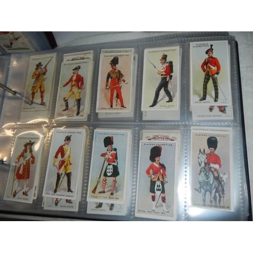 1680 - Nine albums of part sets of cigarette cards.