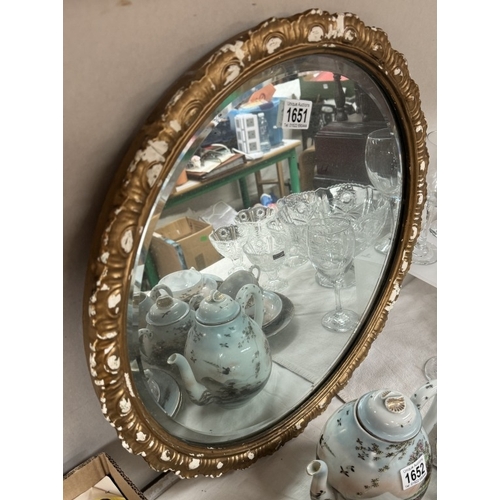 1651 - A vintage round gilt frame bevel edge mirror