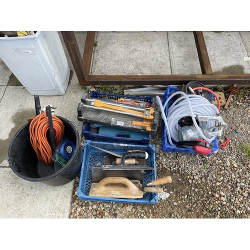 1706 - Four boxes of tools including a tile cutter, power leads etc