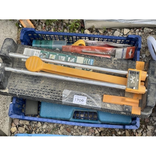 1706 - Four boxes of tools including a tile cutter, power leads etc