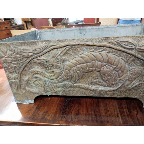 1646 - A large 19th century Chinese zinc lined brass planter with relief dragon decorations, 64 x 36 x 27 c... 