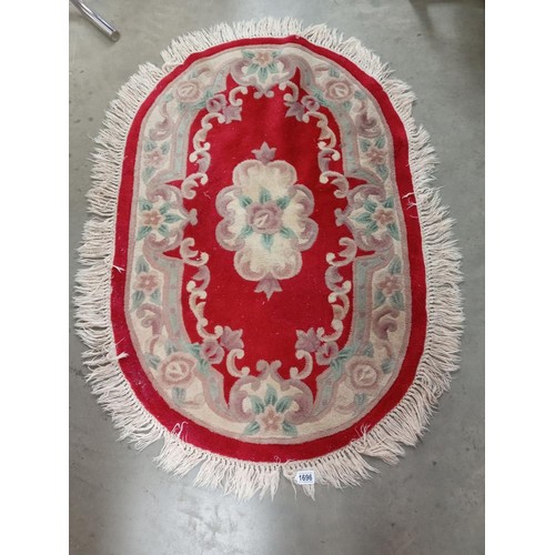 1696 - A Chinese handmade 100% wool rug. Size approximately 122 x 82cm