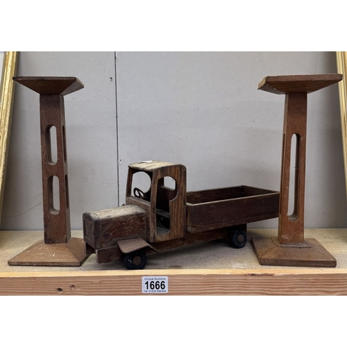 1666 - A pair of arts & crafts oak candlesticks & A handmade wooden lorry