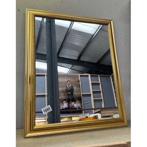 1668 - A gilt framed mirror