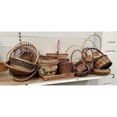 1693 - A quantity of Wicker garden baskets etc