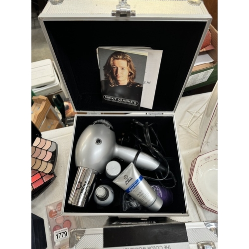 1779 - A quantity of unused makeup & A Nicky Clarke hair dryer etc