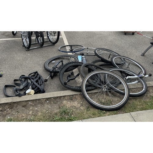 1873 - Three bicycles with a large quantity of spare wheels, tyres & a box of tools