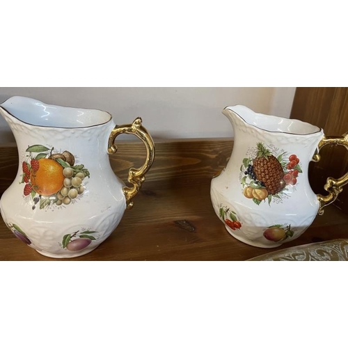 1605 - 4 china & pottery jugs including Fenton & fruit patterns