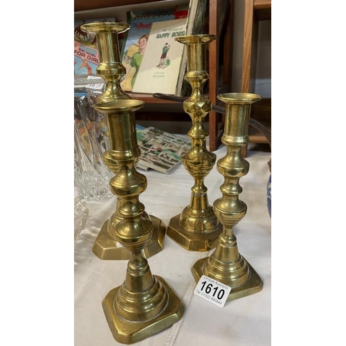 1610 - 2 pairs of brass candlesticks