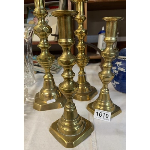 1610 - 2 pairs of brass candlesticks