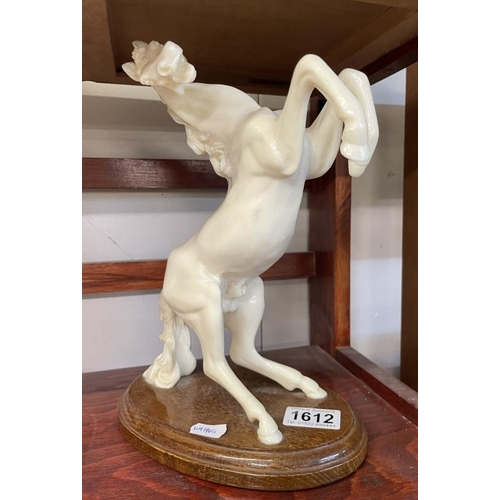 1612 - A white rearing horse figure on stand