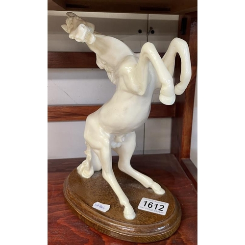 1612 - A white rearing horse figure on stand