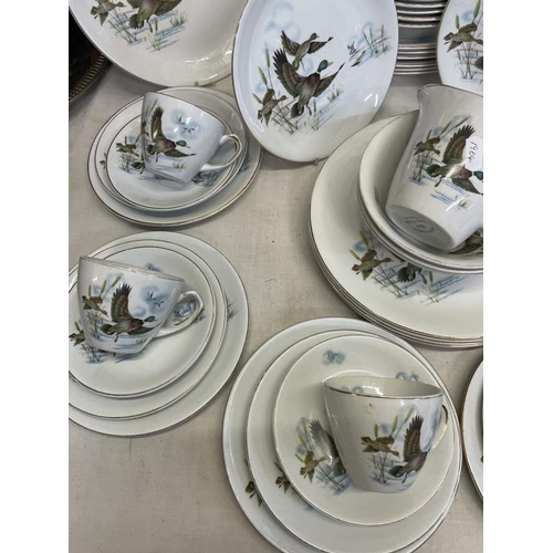 1621 - A dinner & tea service featuring flying duck pattern (approximately 50 pieces)