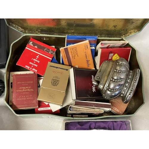 1642 - A vintage tin of old match boxes & a lighter