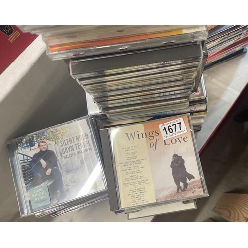 1677 - A large collection of CD's & Video's