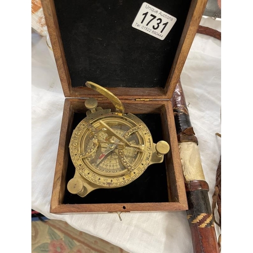 1731 - A cased sundial with built in compass