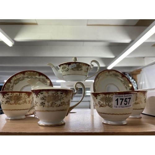 1757 - A tea set consisting of teapot, 2 cups & saucers, sugar bowl & milk jug in decorative gold design