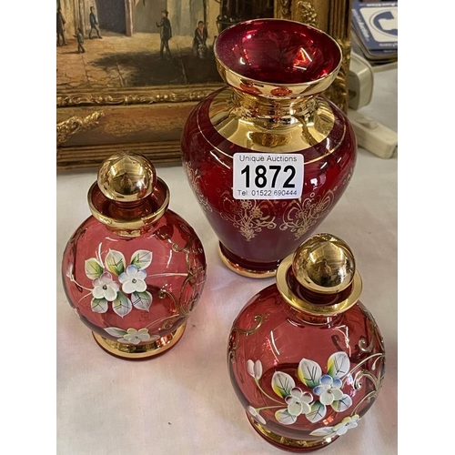 1872 - A pair of Bohemian ruby glass flower decorated perfume bottles & a red glass vase