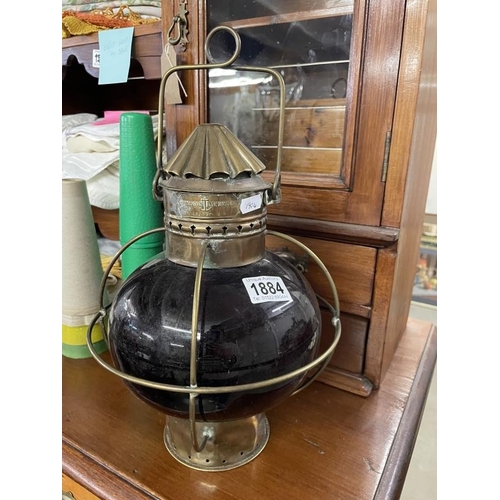 1884 - A red glass lens oil navigation lamp (multi directional)