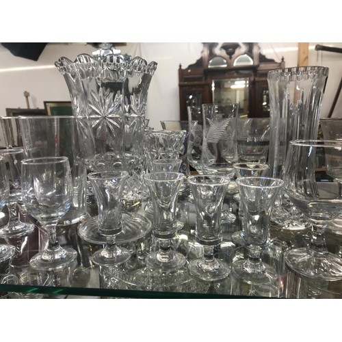 1724 - A large quantity of glassware including decorative bowl, brass pin & glasses etc