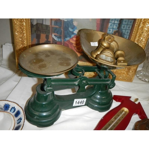 1440 - A pair of vintage style kitchen scales with weights.