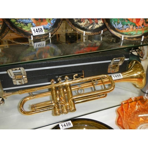 1456 - A cased brass trumpet.