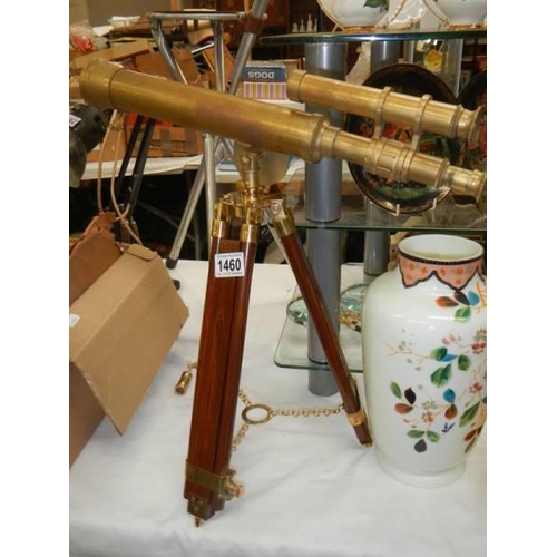 1460 - A brass telescope on tripod stand.