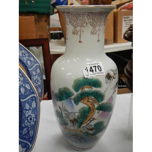 1470 - A ceramic hand painted vase.