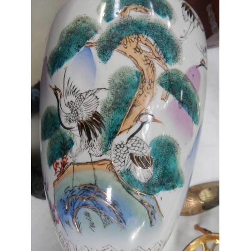 1470 - A ceramic hand painted vase.