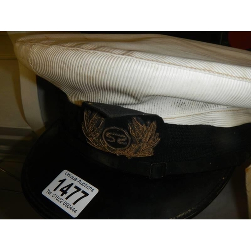 1477 - A military style peaked cap.