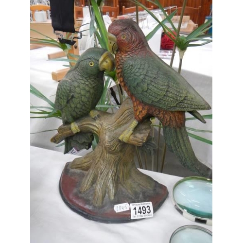 1493 - A cast iron parrot door stop.